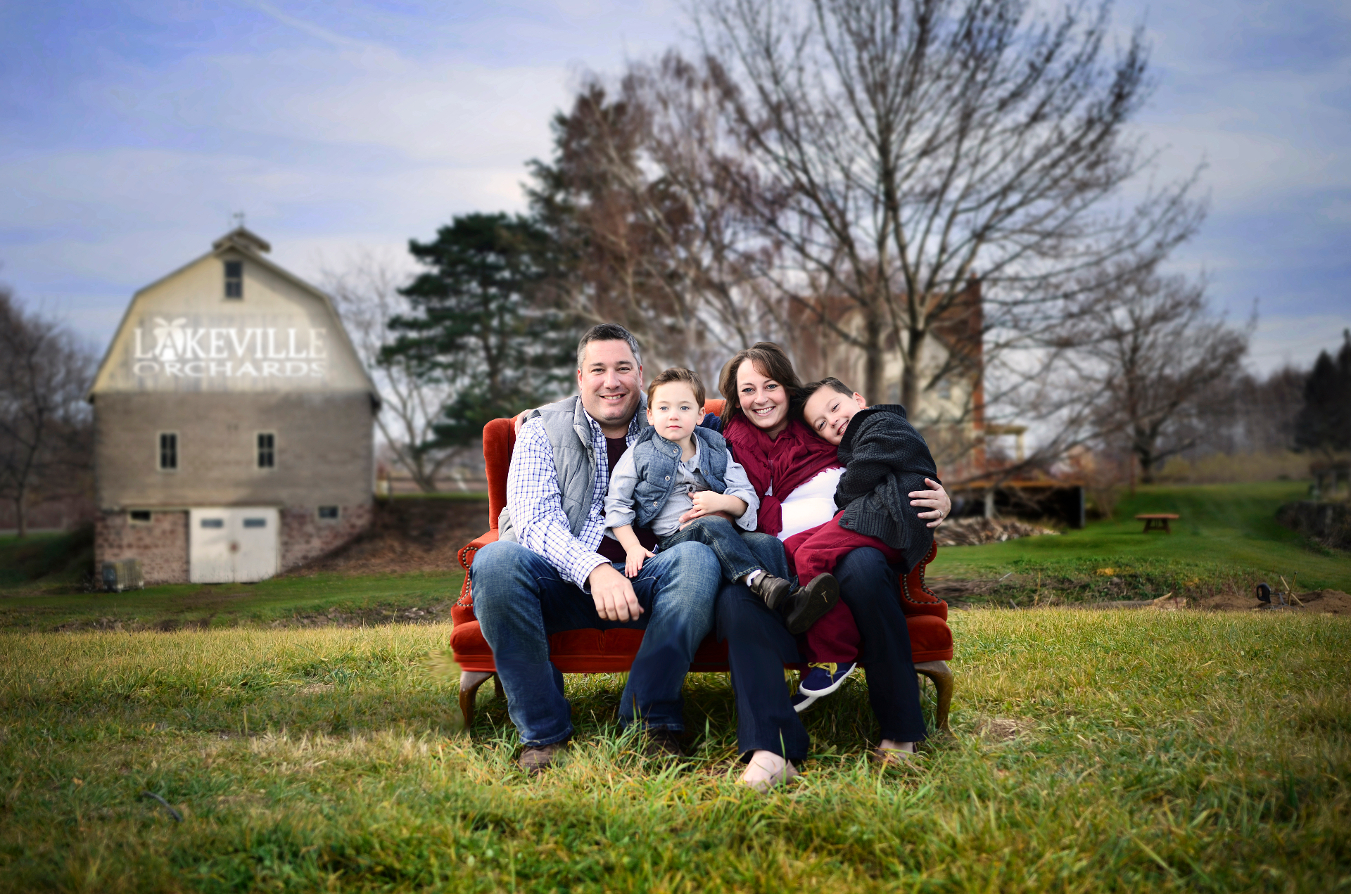 The Sonneville family in front of the Lakeville Orchards barn